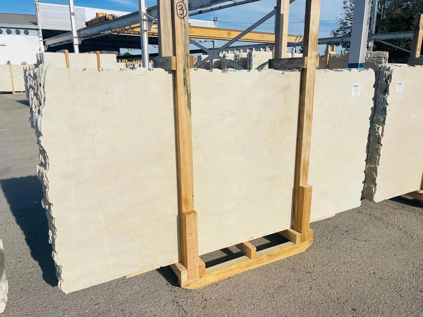Light natural stone slab in raw format